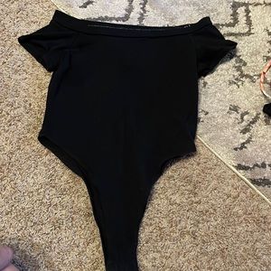 Black bodysuit off the shoulder